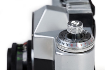 Antique photo camera close up on white background