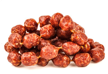 Mini sausages on white background