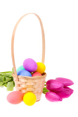 Basket with Easter eggs and flowers