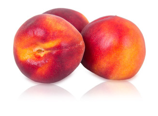 Three ripe peaches
