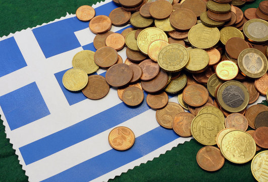 Euro Coins Over Flag Of Greece