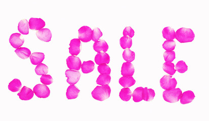 Word " Sale " lined with petals of pink roses