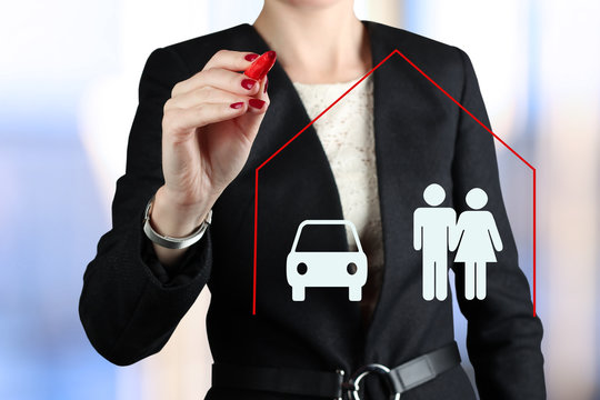 Businesswoman   drawing insurance concept by  a red pen