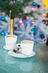 Obraz na płótnie Canvas Cup with coffee in the Restourant.Christmas time.