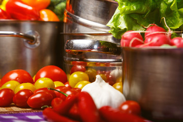 Vegetables and pans on the table