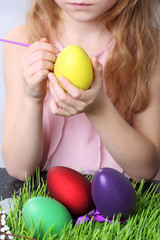 Fototapeta na wymiar Youth and girl painting easter egg