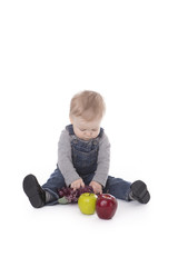 Fototapeta premium Baby girl in overalls