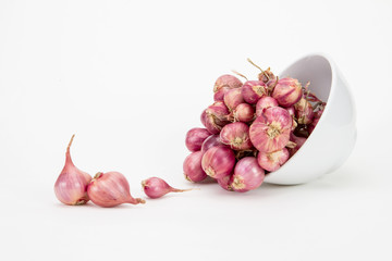 red onion or shallots in white bowl