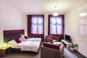 Spacious hotel room with two single beds