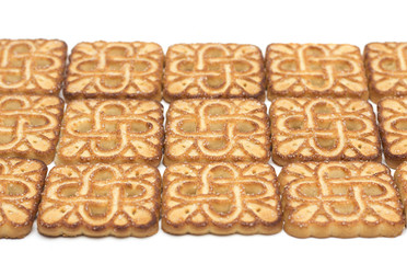 Square tea biscuits. Background. Photo.