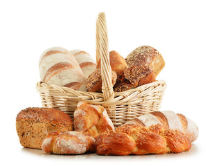 Wicker basket with baking products isolated on white