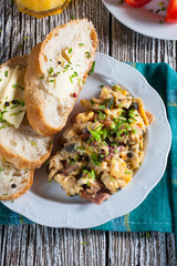 Scrambled eggs with ham and chives.