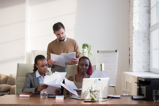 Business people of different ethnicity working together