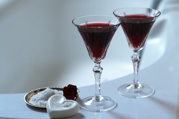 Two glasses of red wine in the bathroom