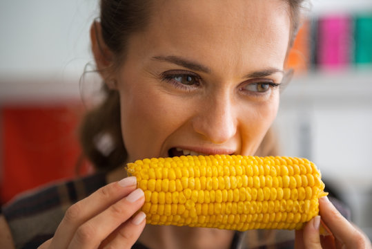 Young Woman Eating Boiled Corn