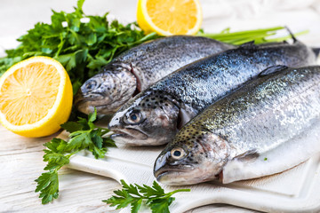 River trout with fresh tomatoes, lemon and herbs