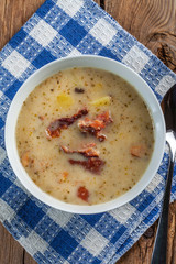 Sour soup with bread.