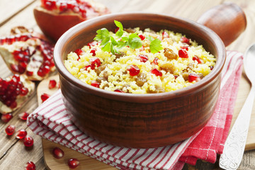 Couscous with pomegranate, raisins and spices