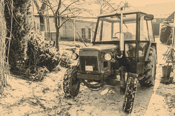 Fototapeta na wymiar Old red Czech tractor in the winter
