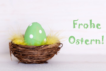One Green Easter Egg In Nest With German Frohe Ostern