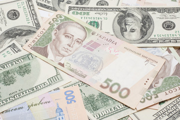 Fototapeta na wymiar the many dollars and ukrainian money. money background