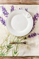 Plate and fork on vintage wooden dining table