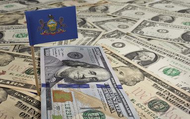 Flag of Pennsylvania sticking in various american banknotes.(ser