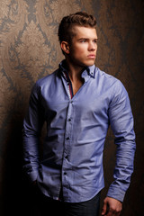 Fashion portrait of man in jacket and sunglasses.
