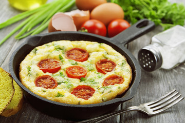 Omelet with vegetables and cheese. Frittata