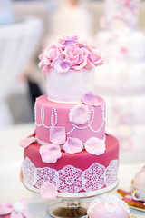White wedding cake decorated with sugar flowers