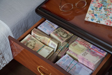 Bundles of banknotes in bedside table