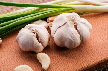 onions and garlic on a wooden table