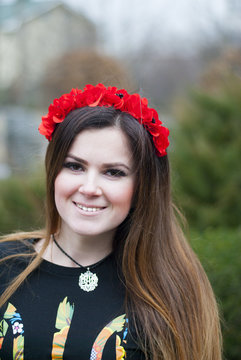 beautiful smiling girl in a wreath
