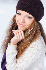 portrait of a beautiful young woman with snow on her hair