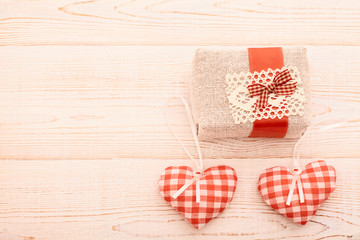 Hearts and gift on wooden background. Valentines day. Beautiful.