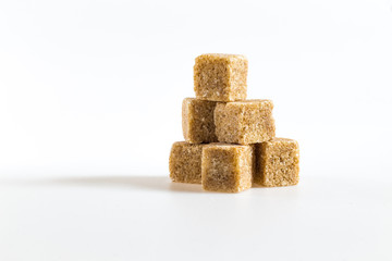 cane sugar cubes on a white background
