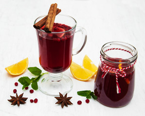 Glasses of mulled wine with lemon and cranberries