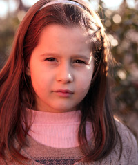Fototapeta premium portrait of seven year old girl outdoors