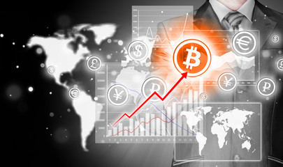 Choosing bitcoins, businessman pressing touch screen button.