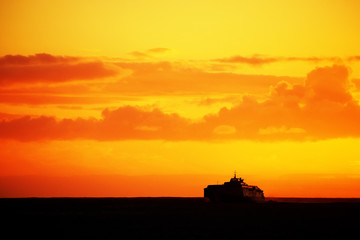 Ship in sunset light