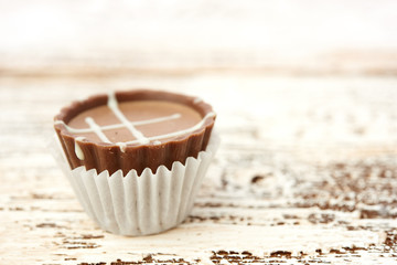 Dark chocolate on wooden background