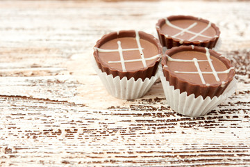 Dark chocolate on wooden background