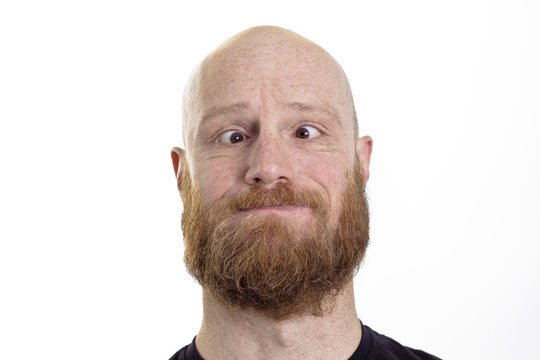 silly bald man with red beard and crossed eyes