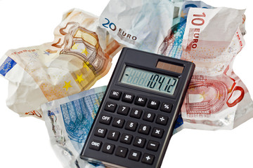 Taschenrechner mit Geldscheinen