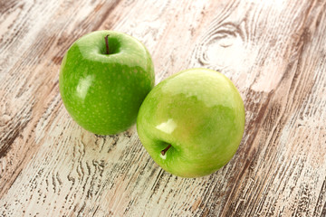 green apple on wooden background