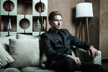 Businessman sitting on an armchair