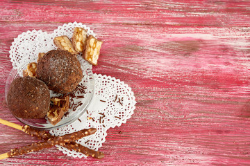 Cupcake with chocolate on wooden background