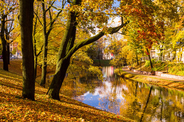 Park in the fall and pond in the center of Riga