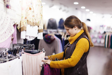 woman choosing clothes at  store