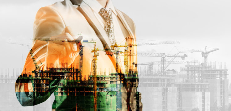 double exposure of businessman and construction site, business c